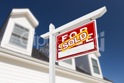 Right Facing Sold For Sale Real Estate Sign In Front of House an