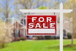 Left Facing For Sale Real Estate Sign In Front of House.
