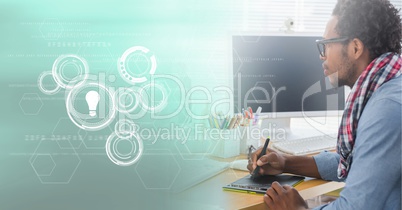 Business man using graphic tablet with graph overlays