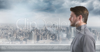 Man looking left with skyline in background