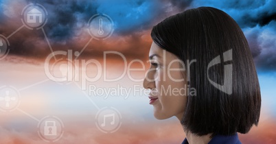 Woman looking at interface in clouds