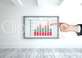 Hand pointing at chart statistics on wall frame
