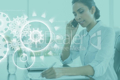 Business woman writing with graph overlays Business woman writing with graph overlays