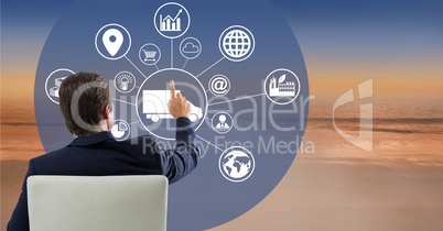 Man touches interface with sea in background