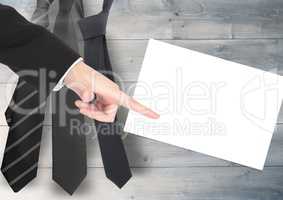 Businessman pointing with chart on white card with tie's