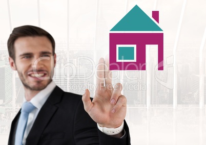 Businessman touching house icon