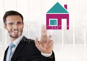 Businessman touching house icon