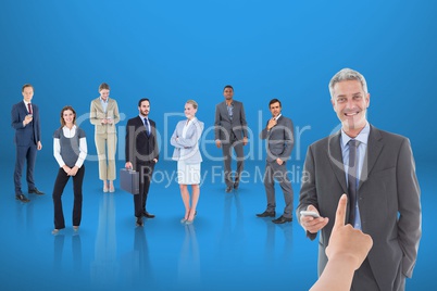 Hand choosing a business man on blue background with business people