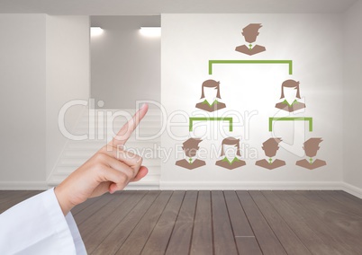 Hand interacting with Business people connected icons on wall