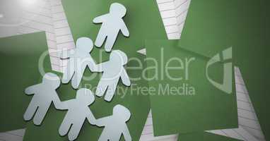 Paper cut out people on green sticky notes