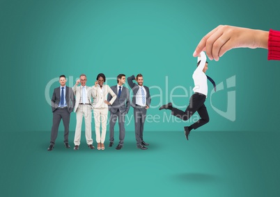Hand choosing a man on a green background with business people