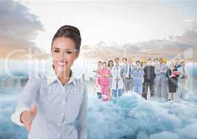 Business woman facing out with smoke, city and coworkers behind her