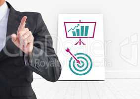 Hand pointing with business icons on white board