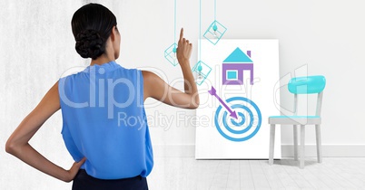 Woman pointing with business icons on white board