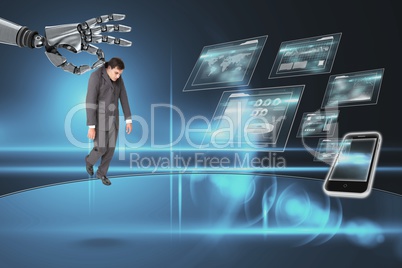 Robot hand choosing a business man on dark background