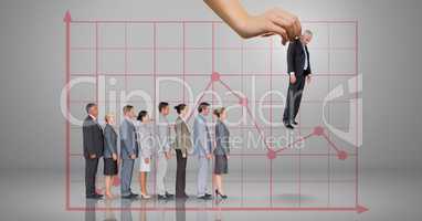 Hand choosing a business man on grey background with graph and business people