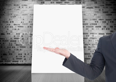 Business hand open with white board on wall