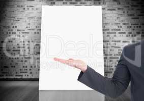 Business hand open with white board on wall