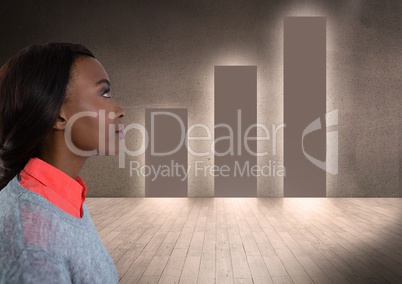 Young woman looking past graph on wall