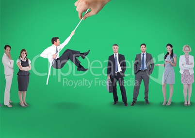 Hand choosing a man with a rope on a green background with business people