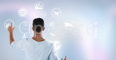 Standing man touching interface on wall