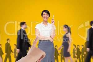 Hand choosing a business woman on yellow background with business people walking