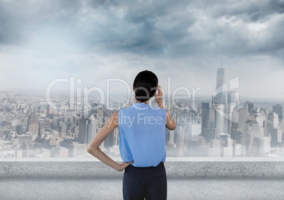 Business woman looking over skyline