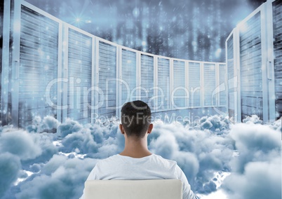 Teenager sitting looking at simulation through clouds