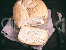 round yeast bread and a kitchen knife