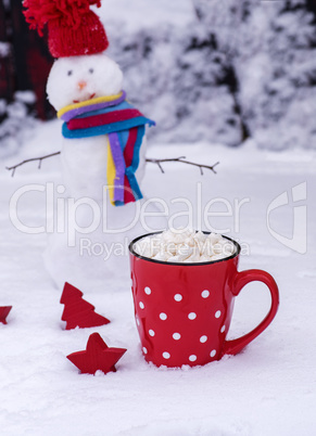 mug with white polka dots with hot chocolate and marshmallows