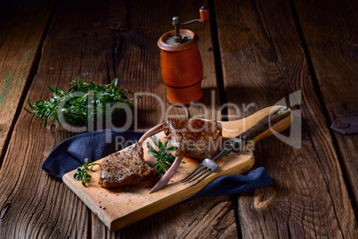 Grilled lamb chops an old board