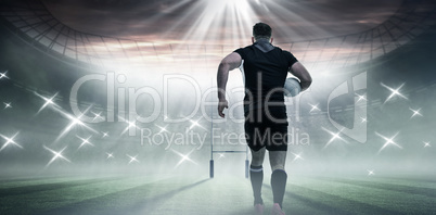 Composite image of rugby player running with the ball