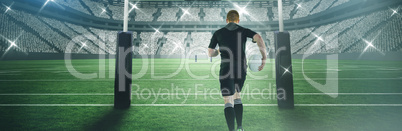 Composite image of rugby player running with a rugby ball