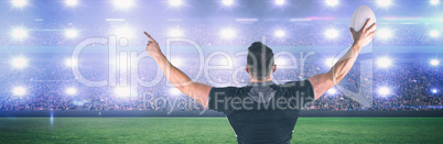 Composite image of rugby player celebrating with the ball