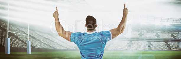 Composite image of rugby player cheering and pointing