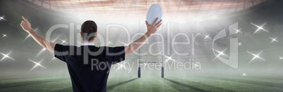 Composite image of rugby player about to throw a rugby ball