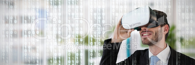 Composite image of smiling businessman holding vr glasses