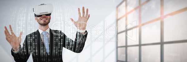 Composite image of smiling businessman with vr glasses gesturing against white background