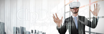 Composite image of businessman with vr glasses gesturing against white background