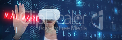 Composite image of businesswoman gesturing while using virtual reality headset