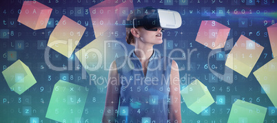 Composite image of young businesswoman wearing virtual reality glasses