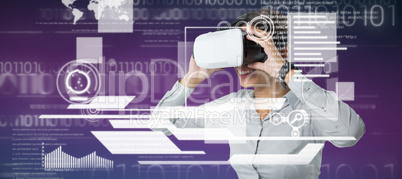 Composite image of female executive using virtual reality headset