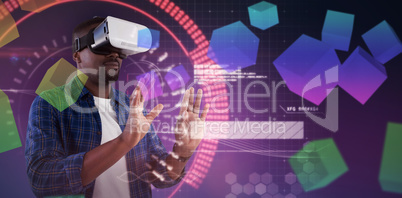 Composite image of man gesturing while using virtual reality headset