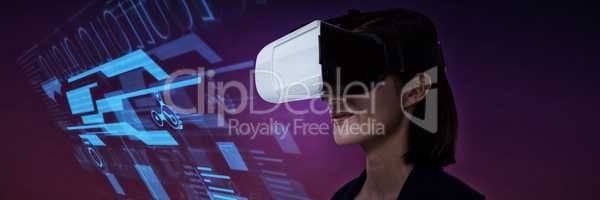 Composite image of businesswoman using virtual reality headset