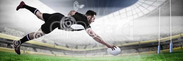 Composite image of full length of rugby player scoring goal