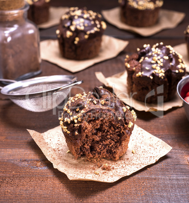 chocolate muffin with a sprinkle of nuts