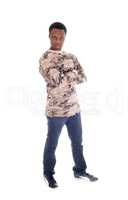 African man standing in jeans and sweater