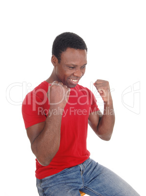 Happy African man with fists, smiling