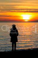 People silhouette on the sunset light near the lake Balaton in Hungary