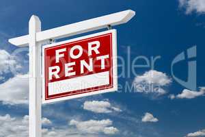Right Facing For Rent Real Estate Sign Over Blue Sky and Clouds